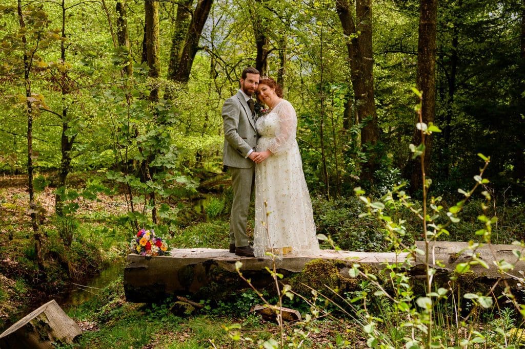 beautiful wedding photo of the bride and groom in the grounds of craig y nos castle and ountry park